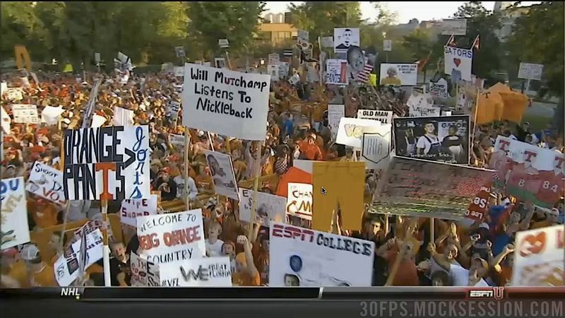 Illustration for article titled "Will Muschamp Listens To Nickelback": Your Roundup Of The Best Signs Behind The College Gameday Crew